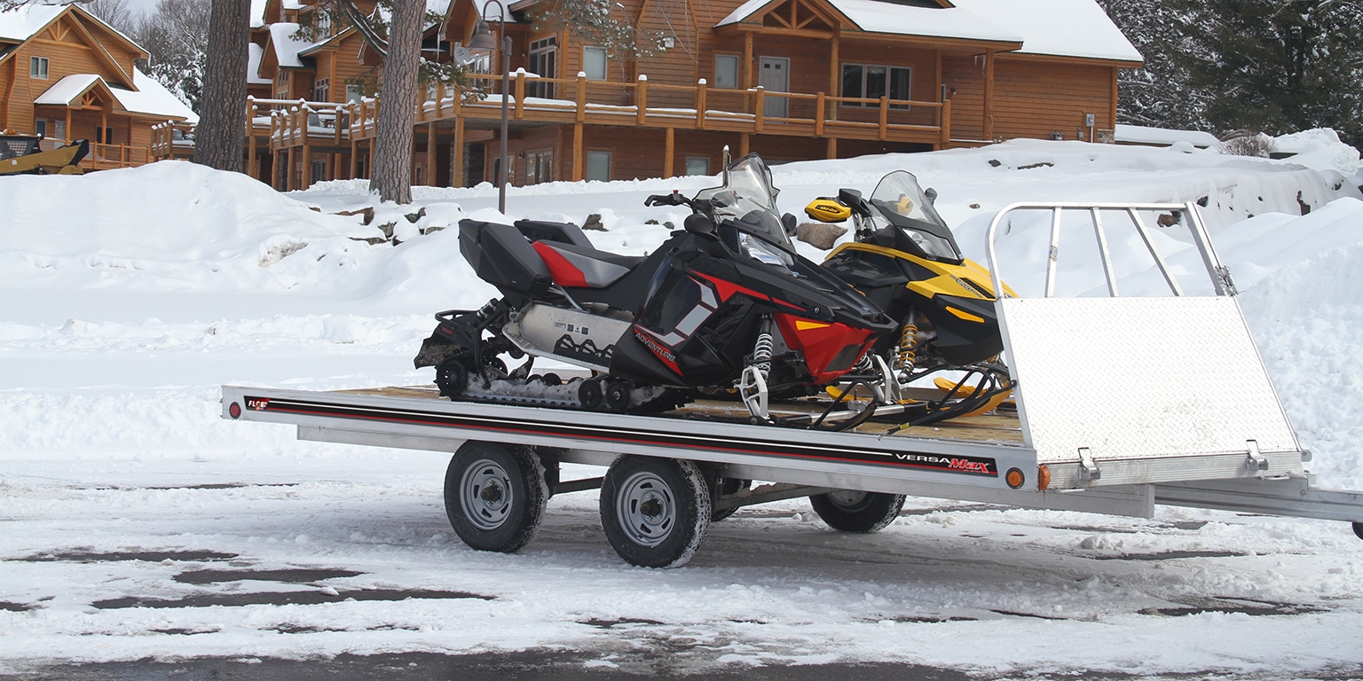 Aluminum utility trailer with enclosure used for snowmobile hauling in winter